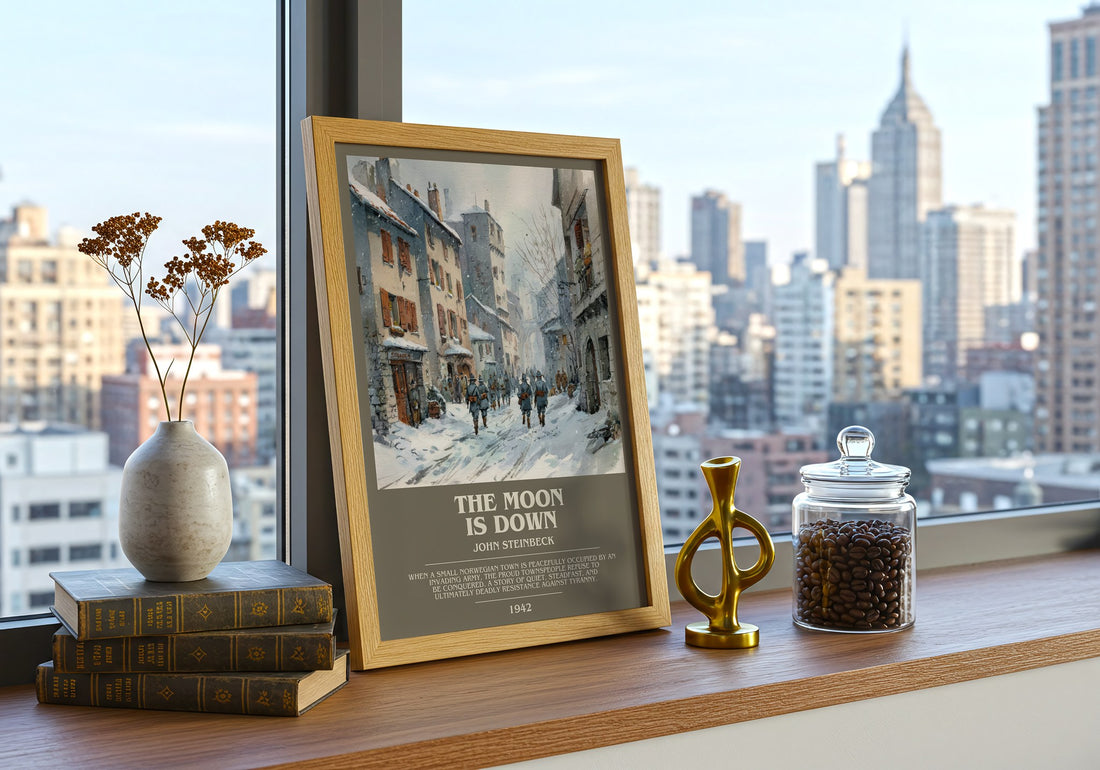 The Moon Is Down Bookish Wall Art by John Steinbeck – framed print on a city-view windowsill