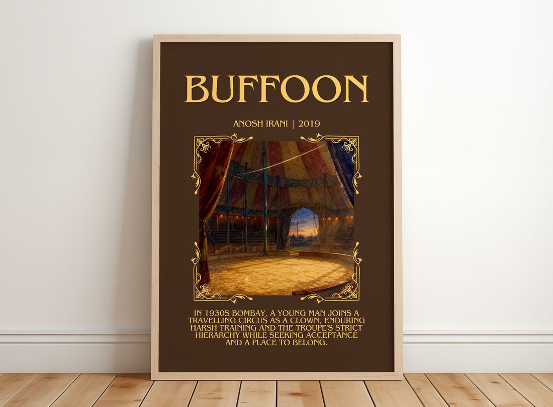 Buffoon Minimalist Book Poster by Anosh Irani – framed print leaning on a wooden floor
