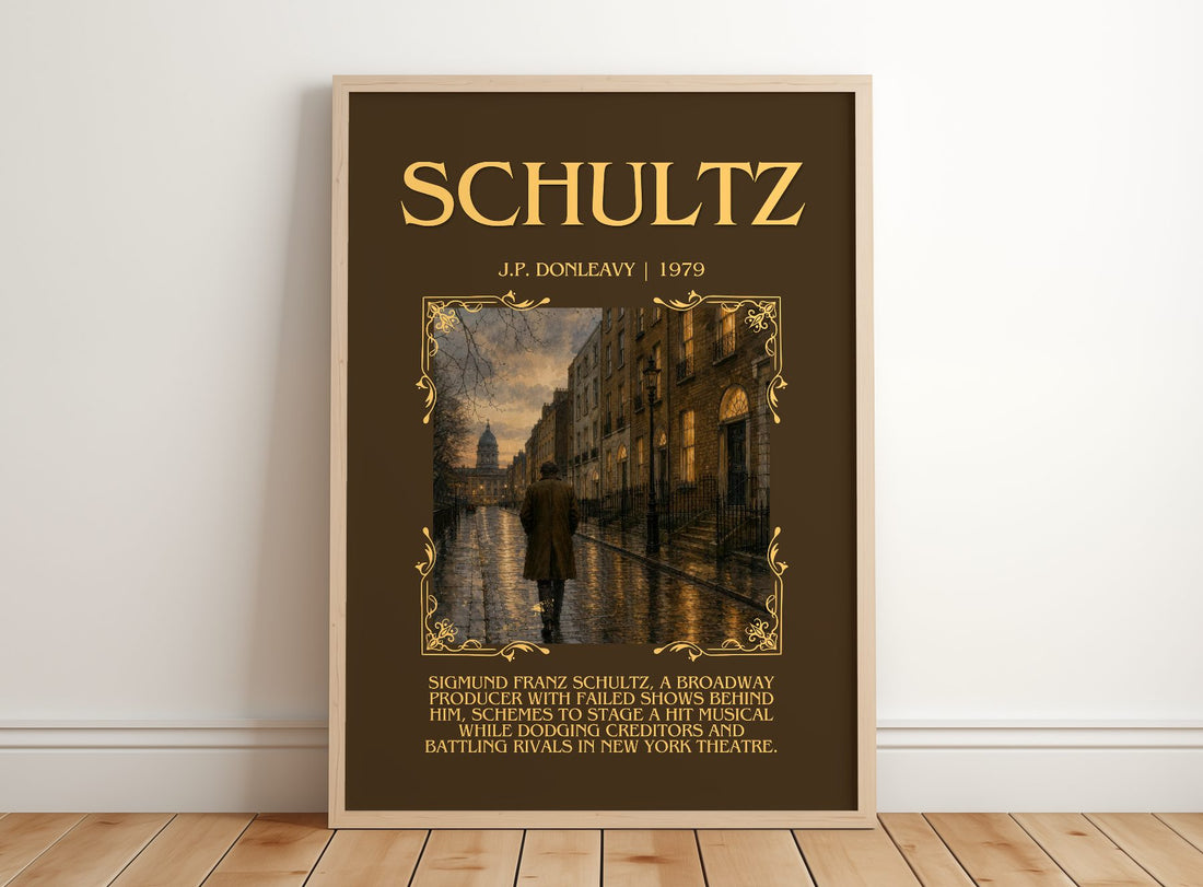 Schultz Minimalist Book Poster by J.P. Donleavy – framed print leaning on a wooden floor