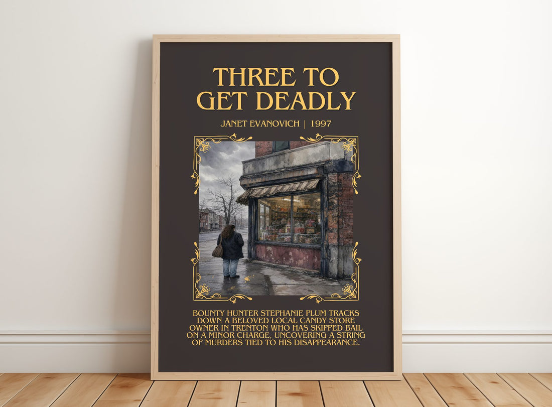 Three to Get Deadly Minimalist Book Poster by Janet Evanovich – framed print leaning on a wooden floor