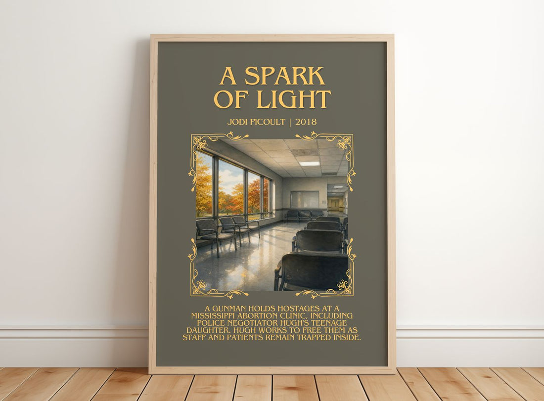 A Spark of Light Minimalist Book Poster by Jodi Picoult – framed print leaning on a wooden floor