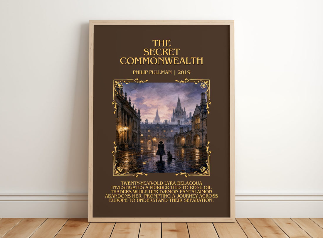 The Secret Commonwealth Minimalist Book Poster by Philip Pullman – framed print leaning on a wooden floor