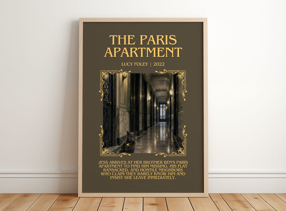 The Paris Apartment Minimalist Book Poster by Lucy Foley – framed print leaning on a wooden floor