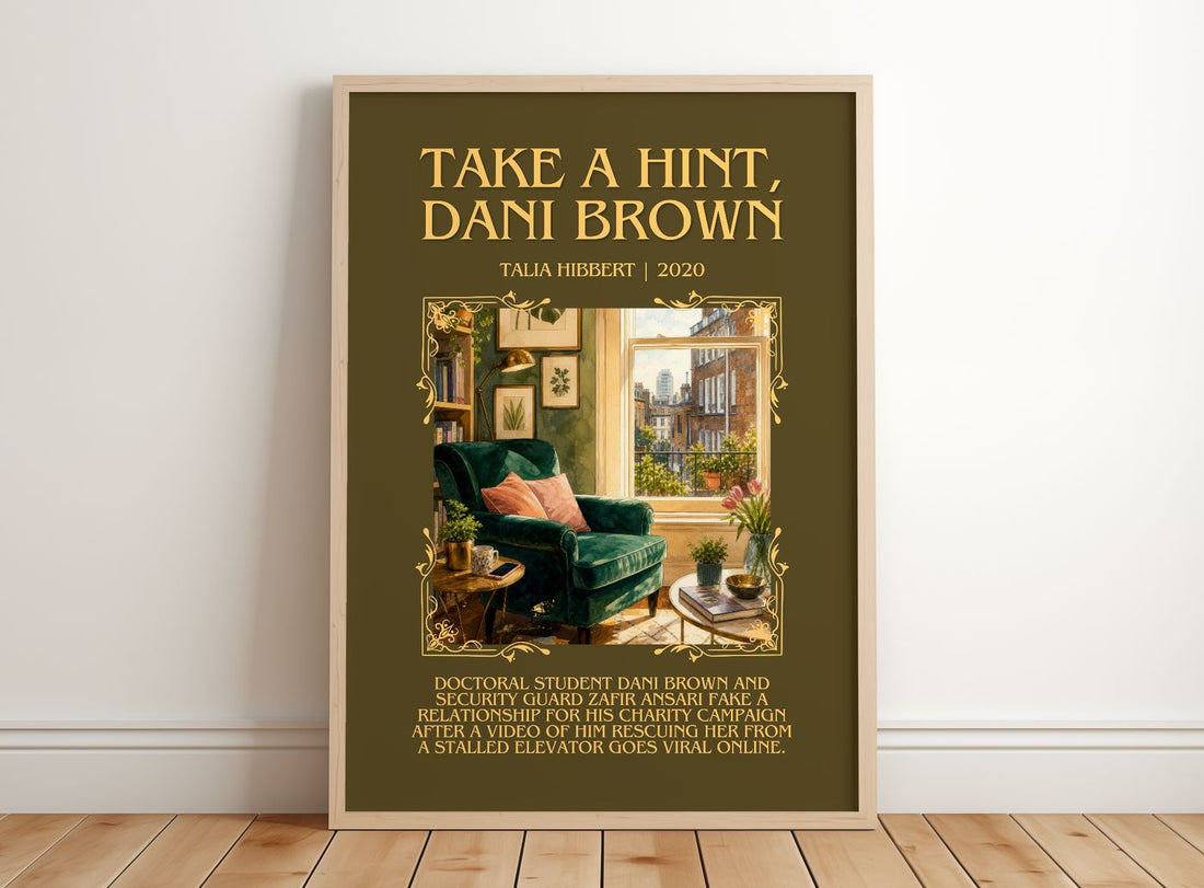 Take a Hint, Dani Brown Minimalist Book Poster by Talia Hibbert – framed print leaning on a wooden floor