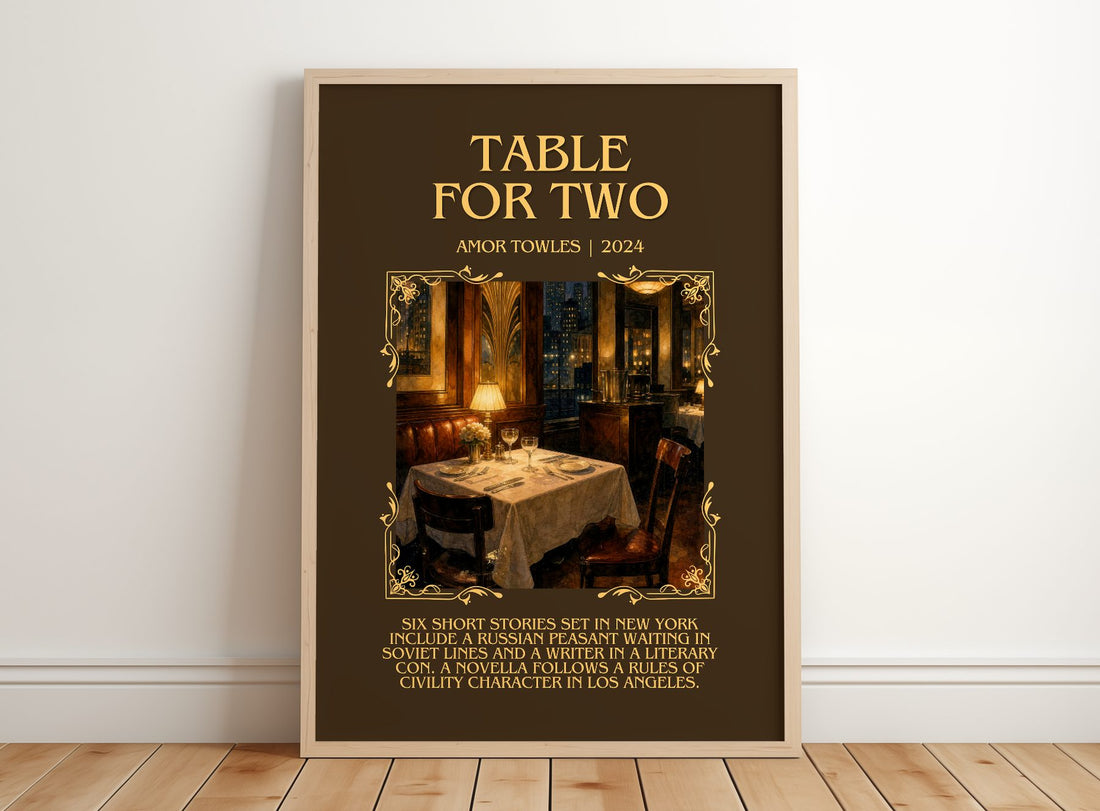 Table for Two Minimalist Book Poster by Amor Towles – framed print leaning on a wooden floor