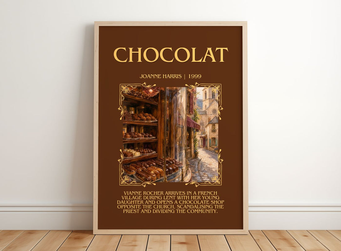 Chocolat Minimalist Book Poster by Joanne Harris – framed print leaning on a wooden floor