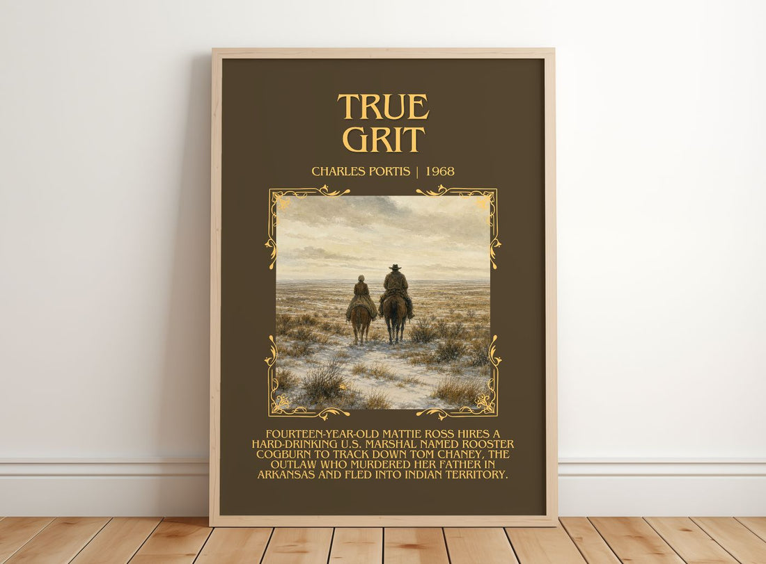 True Grit Minimalist Book Poster by Charles Portis – framed print leaning on a wooden floor