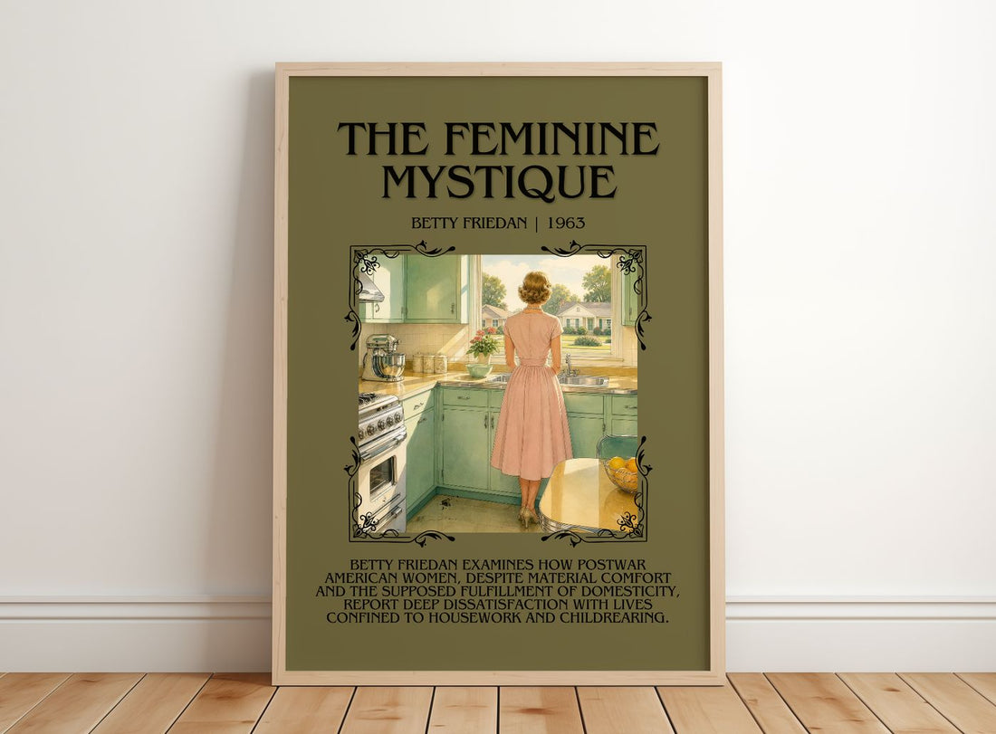 The Feminine Mystique Minimalist Book Poster by Betty Friedan – framed print leaning on a wooden floor