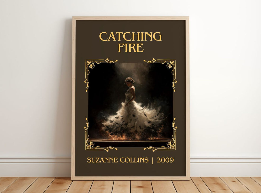 Catching Fire Classic Book Art Print by Suzanne Collins – framed print leaning on a wooden floor