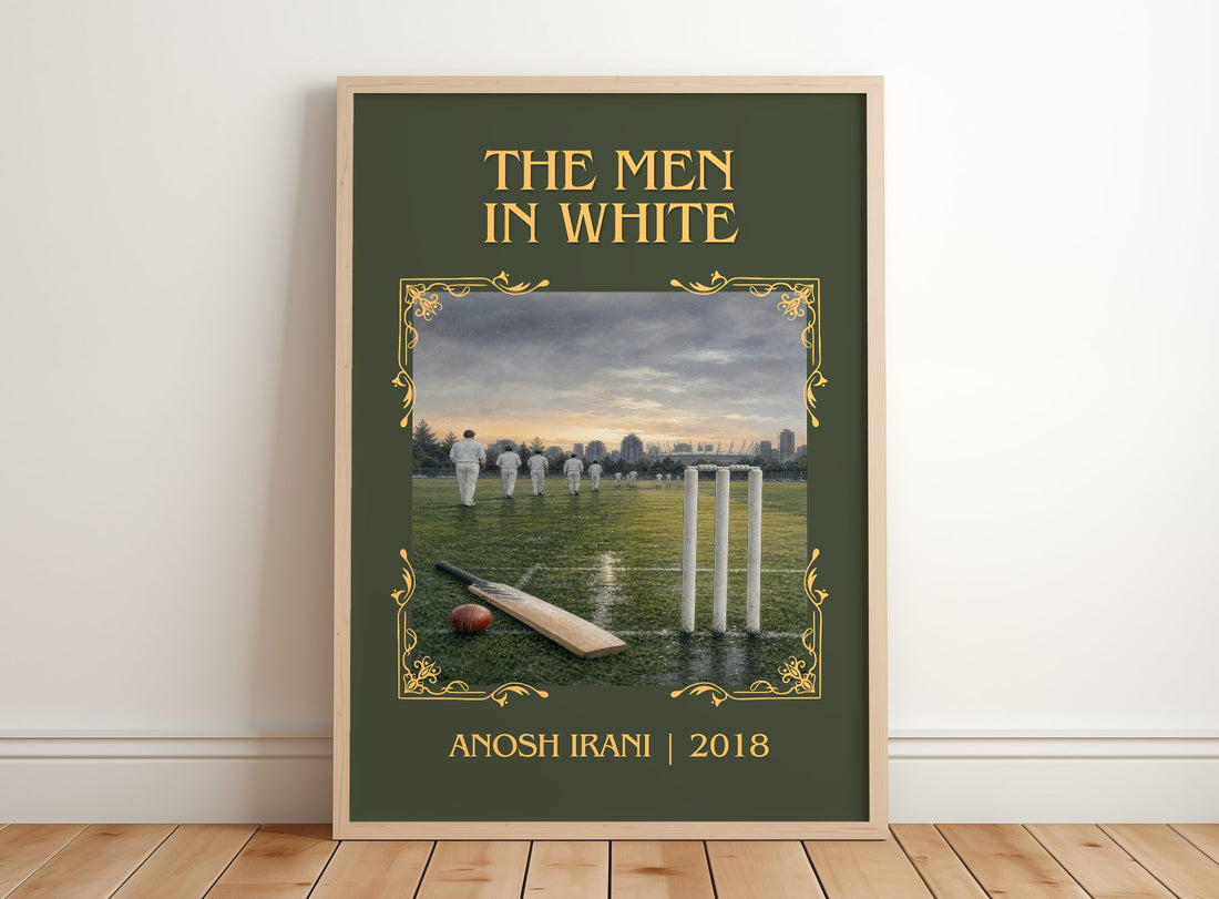 The Men In White Classic Book Art Print by Anosh Irani – framed print leaning on a wooden floor