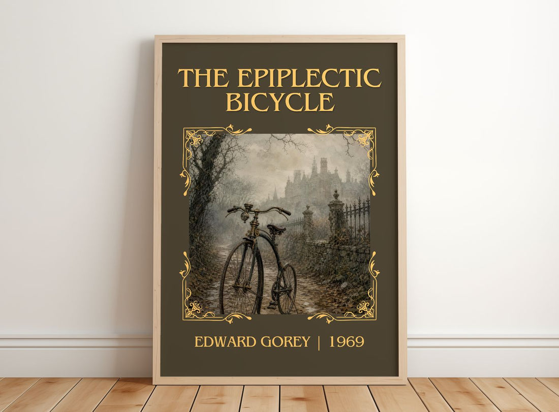 The Epiplectic Bicycle Classic Book Art Print by Edward Gorey – framed print leaning on a wooden floor