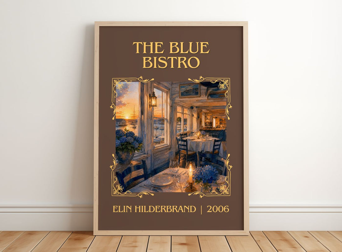 The Blue Bistro Classic Book Art Print by Elin Hilderbrand – framed print leaning on a wooden floor