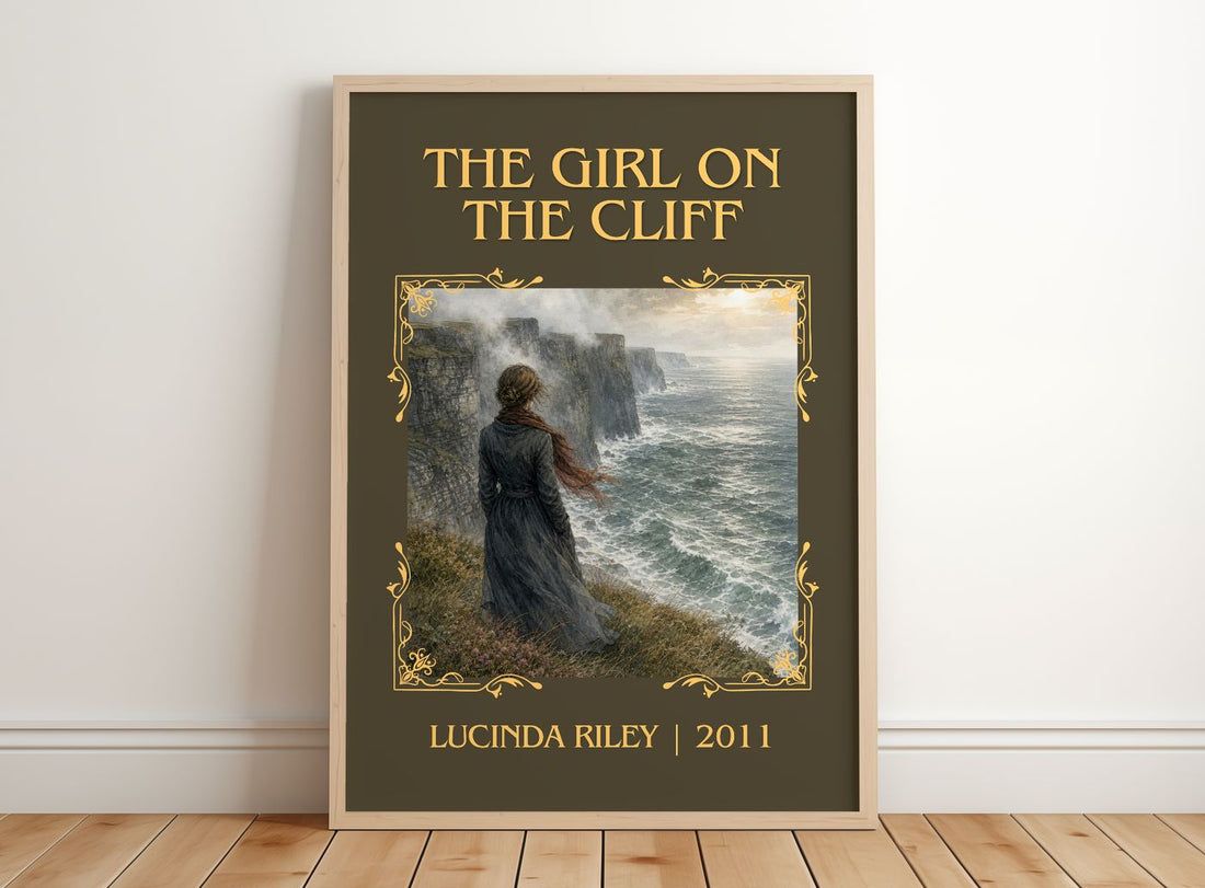 The Girl on the Cliff Classic Book Art Print by Lucinda Riley – framed print leaning on a wooden floor