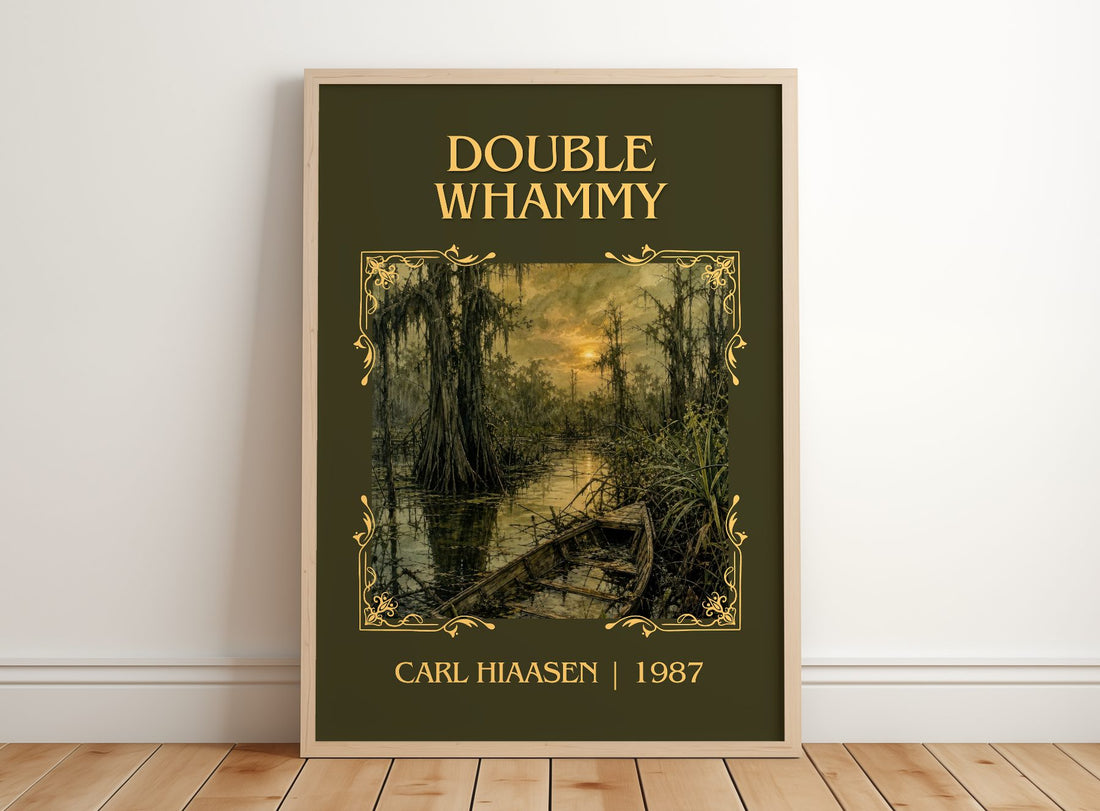 Double Whammy Classic Book Art Print by Carl Hiaasen – framed print leaning on a wooden floor