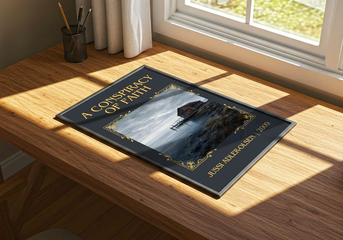 A Conspiracy of Faith Classic Book Art Print by Jussi Adler-Olsen – print on a sunlit desk