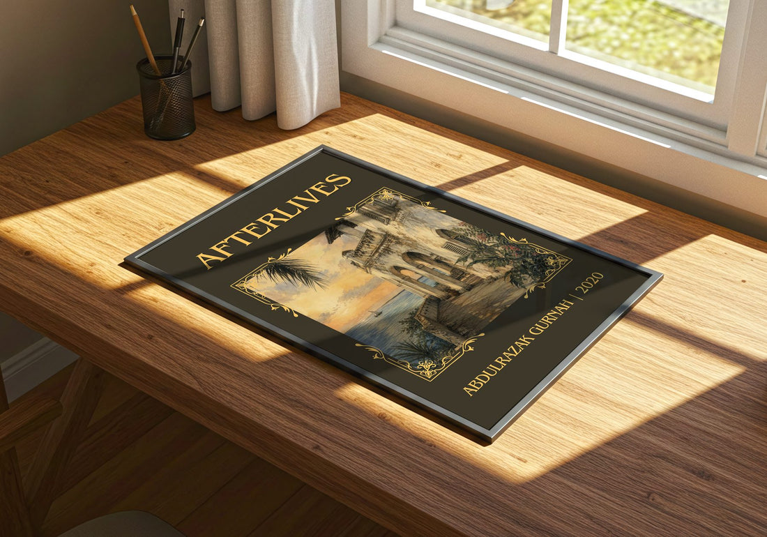 Afterlives Classic Book Art Print by Abdulrazak Gurnah – print on a sunlit desk