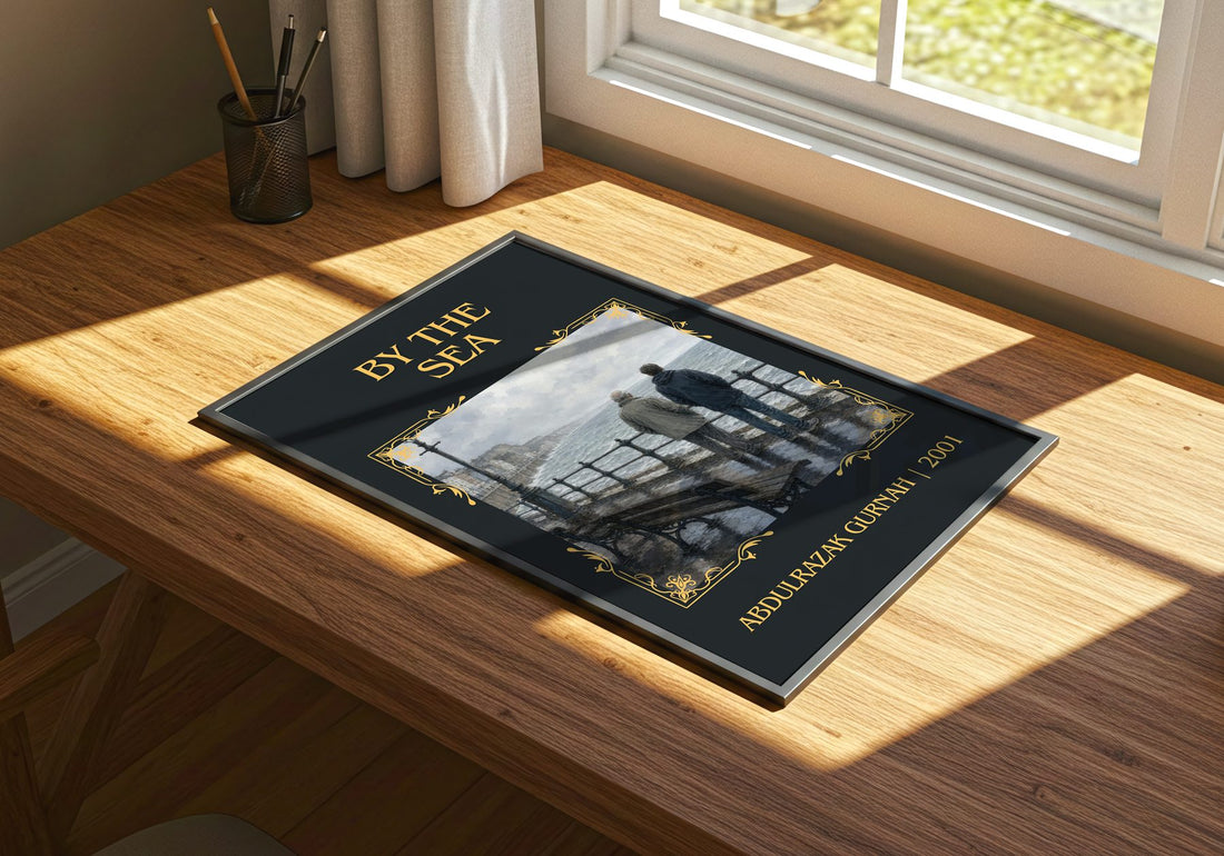 By the Sea Classic Book Art Print by Abdulrazak Gurnah – print on a sunlit desk