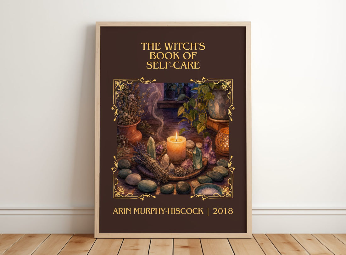Witch's Book of Self-Care Classic Book Art Print by A. Murphy-Hiscock – framed print leaning on a wooden floor