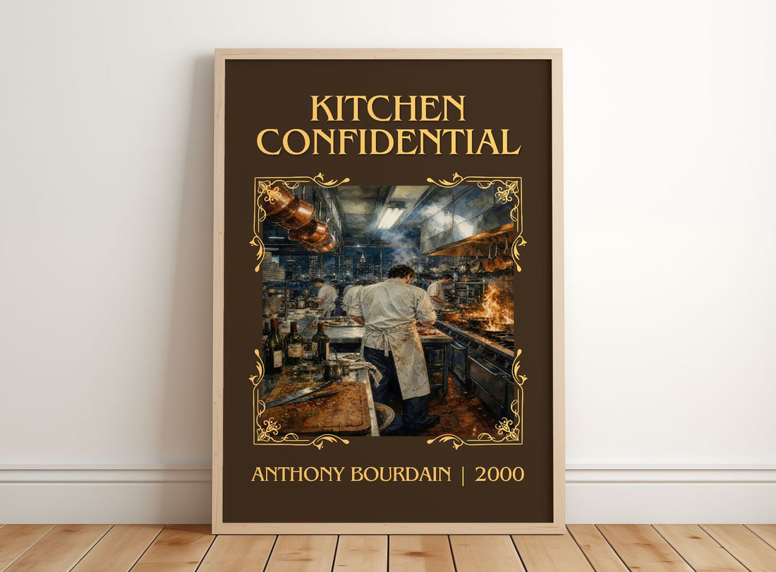 Kitchen Confidential Classic Book Art Print by Anthony Bourdain – framed print leaning on a wooden floor