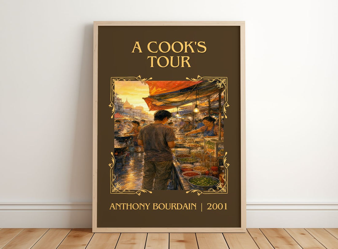 A Cook's Tour Classic Book Art Print by Anthony Bourdain – framed print leaning on a wooden floor