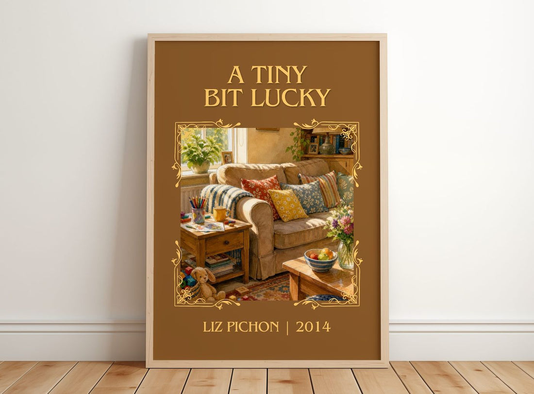 A Tiny Bit Lucky Classic Book Art Print by Liz Pichon – framed print leaning on a wooden floor