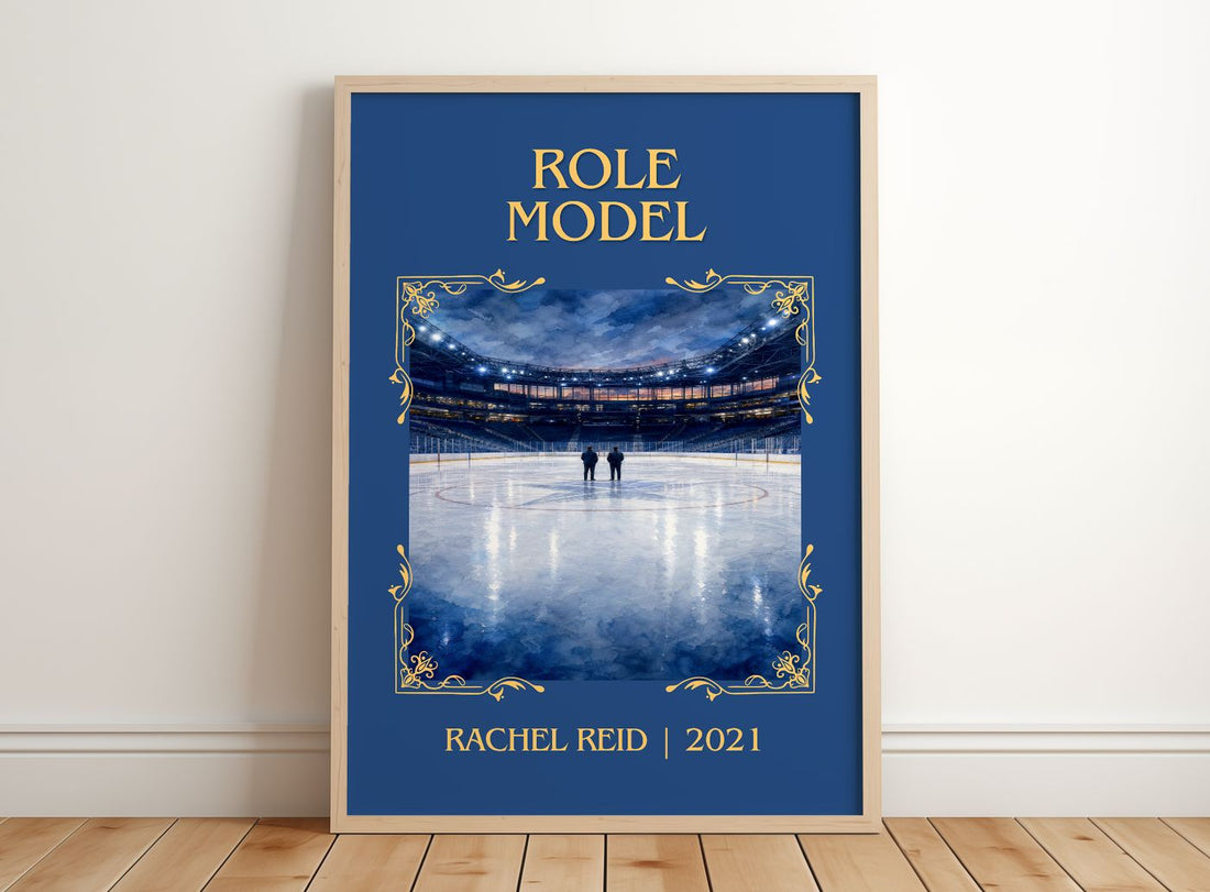 Role Model Classic Book Art Print by Rachel Reid – framed print leaning on a wooden floor