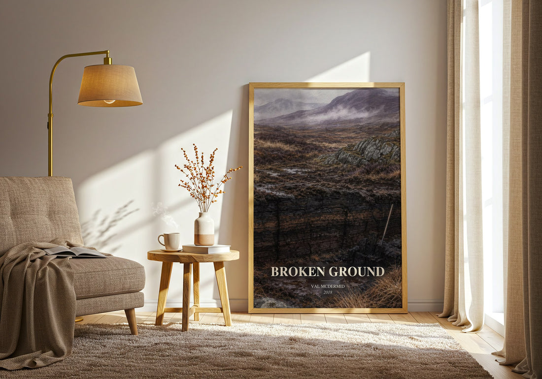Broken Ground watercolour print in frame leaning in hallway – crime wall art (mockup)