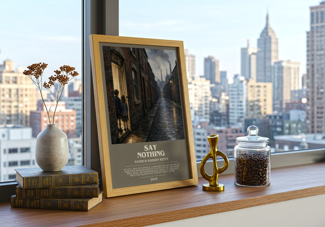 Say Nothing Bookish Wall Art by Patrick Radden Keefe – framed print on a city-view windowsill