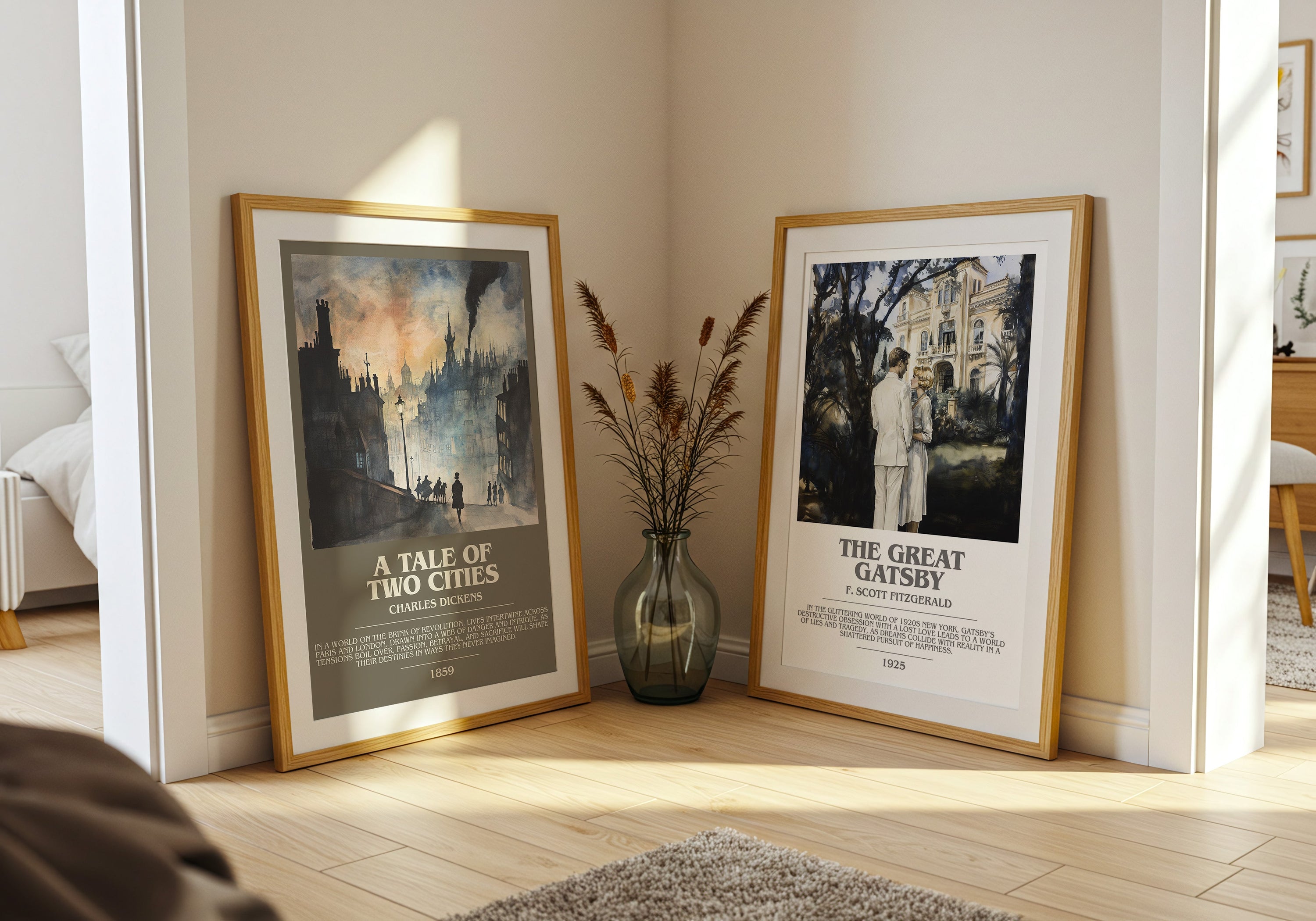 Framed literary art prints of A Tale of Two Cities and The Great Gatsby leaned against a wall with a glass vase with dried grasses