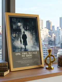 One, Two, Buckle My Shoe Bookish Wall Art by Agatha Christie – framed print on a city-view windowsill