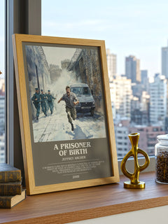 A Prisoner of Birth Bookish Wall Art by Jeffrey Archer – framed print on a city-view windowsill