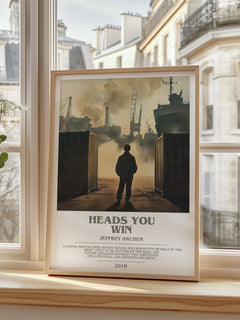 Heads You Win Bookish Wall Art by Jeffrey Archer – framed print by a bright window