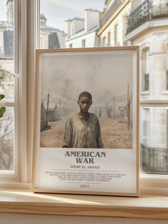 American War Bookish Wall Art by Omar El Akkad – framed print by a bright window