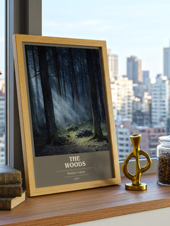 The Woods Book Cover Poster by Harlan Coben – framed print on a city-view windowsill