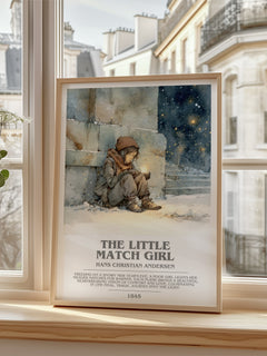 The Little Match Girl Bookish Wall Art by Hans Christian Andersen – framed print by a bright window
