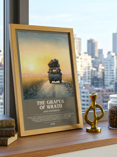 The Grapes of Wrath Bookish Wall Art by John Steinbeck – framed print on a city-view windowsill