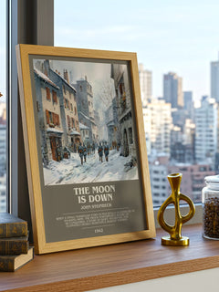 The Moon Is Down Bookish Wall Art by John Steinbeck – framed print on a city-view windowsill