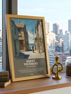 Sweet Thursday Bookish Wall Art by John Steinbeck – framed print on a city-view windowsill