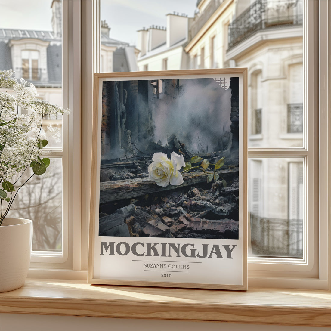 Mockingjay Book Cover Poster by Suzanne Collins – framed print by a bright window