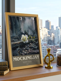 Mockingjay Book Cover Poster by Suzanne Collins – framed print on a city-view windowsill