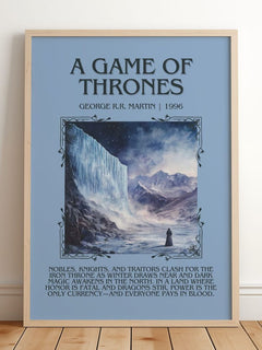 A Game Of Thrones Minimalist Book Poster by George R.R. Martin – framed print leaning on a wooden floor