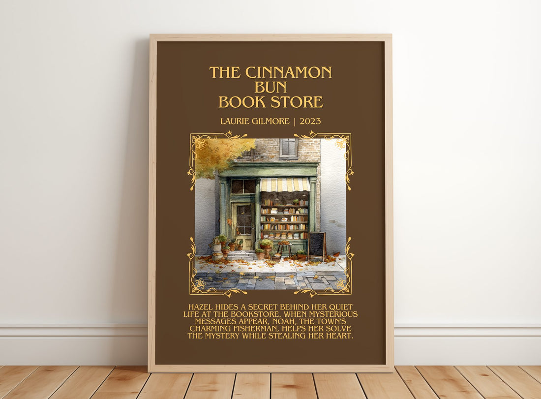 The Cinnamon Bun Book Store Minimalist Book Poster by Laurie Gilmore – framed print leaning on a wooden floor