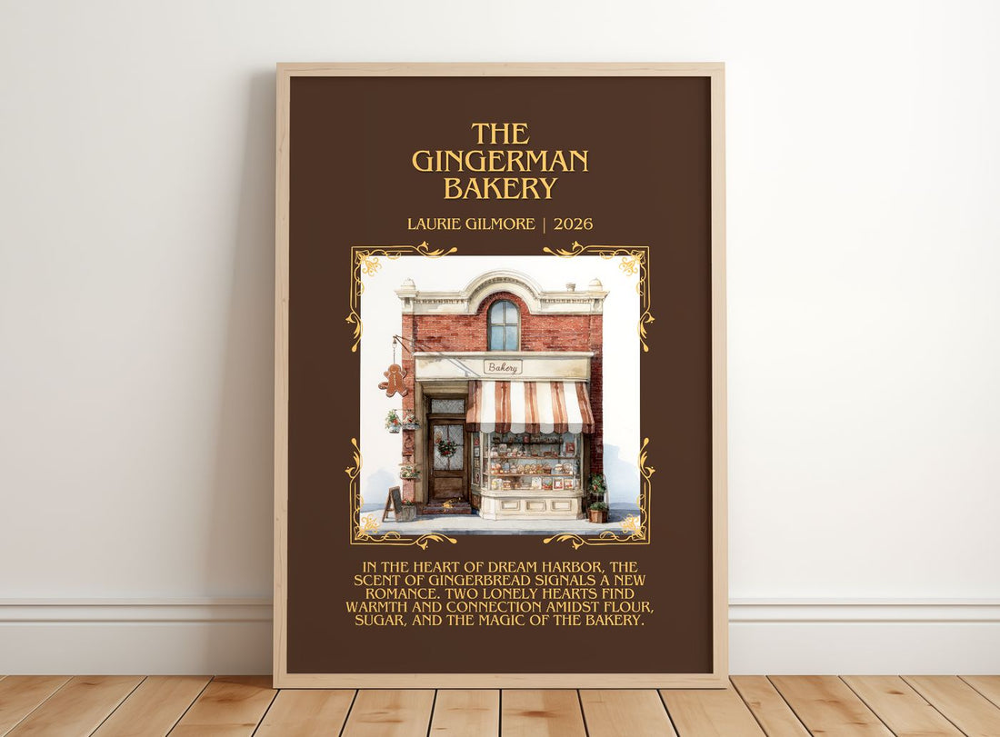 The Gingerman Bakery Minimalist Book Poster by Laurie Gilmore – framed print leaning on a wooden floor