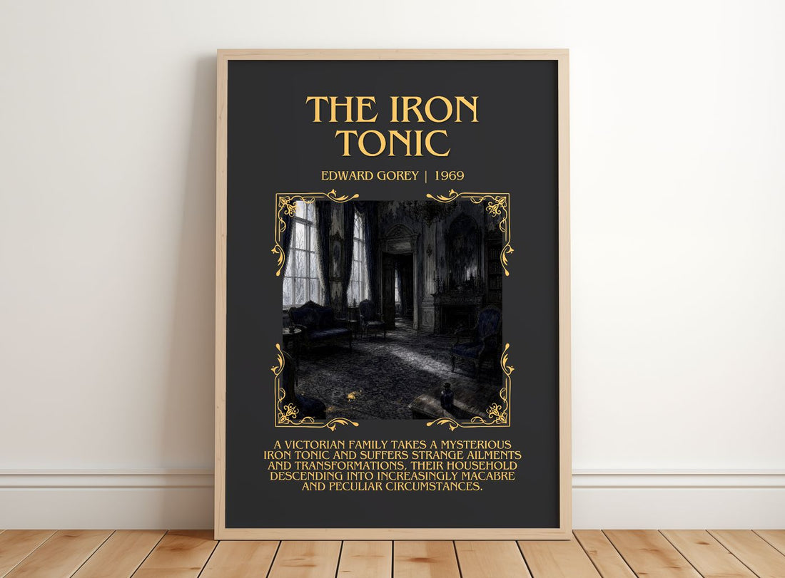 The Iron Tonic Minimalist Book Poster by Edward Gorey – framed print leaning on a wooden floor