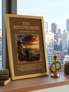 The Adventurers Minimalist Book Poster by Harold Robbins – framed print on a city-view windowsill