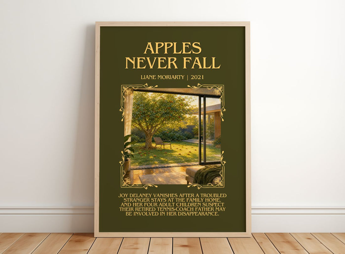 Apples Never Fall Minimalist Book Poster by Liane Moriarty – framed print leaning on a wooden floor