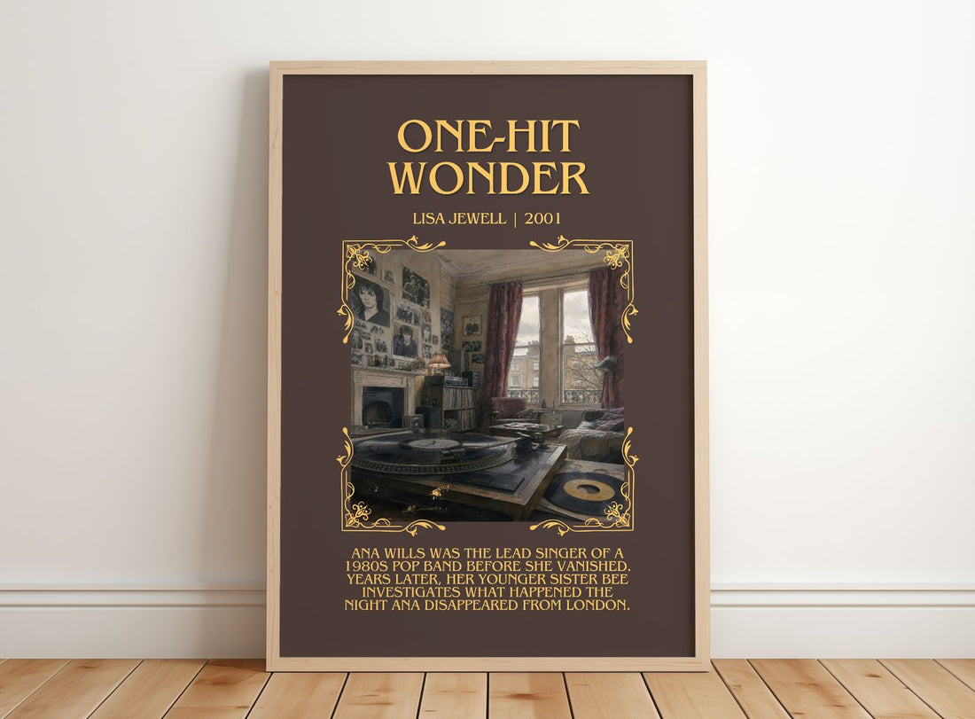 One-Hit Wonder Minimalist Book Poster by Lisa Jewell – framed print leaning on a wooden floor