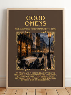 Good Omens Minimalist Book Poster by Neil Gaiman & Terry Pratchett – framed print leaning on a wooden floor