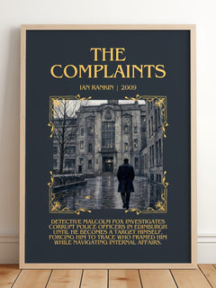 The Complaints Minimalist Book Poster by Ian Rankin – framed print leaning on a wooden floor