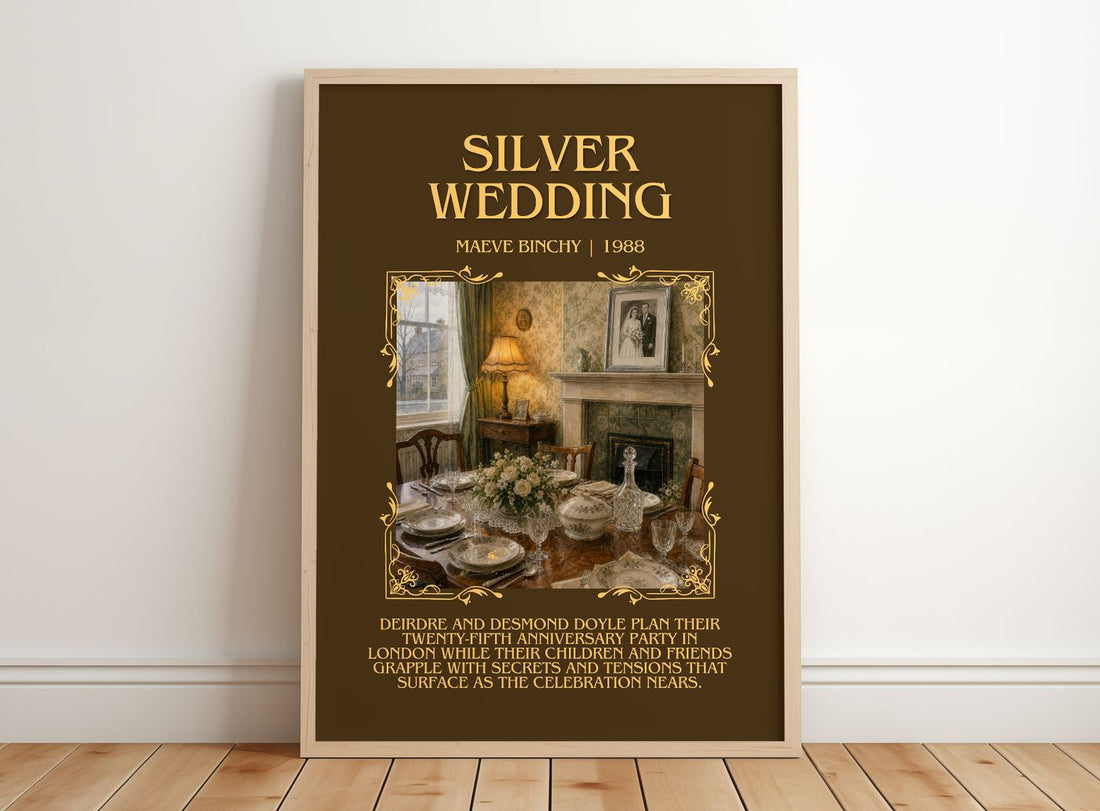 Silver Wedding Minimalist Book Poster by Maeve Binchy – framed print leaning on a wooden floor